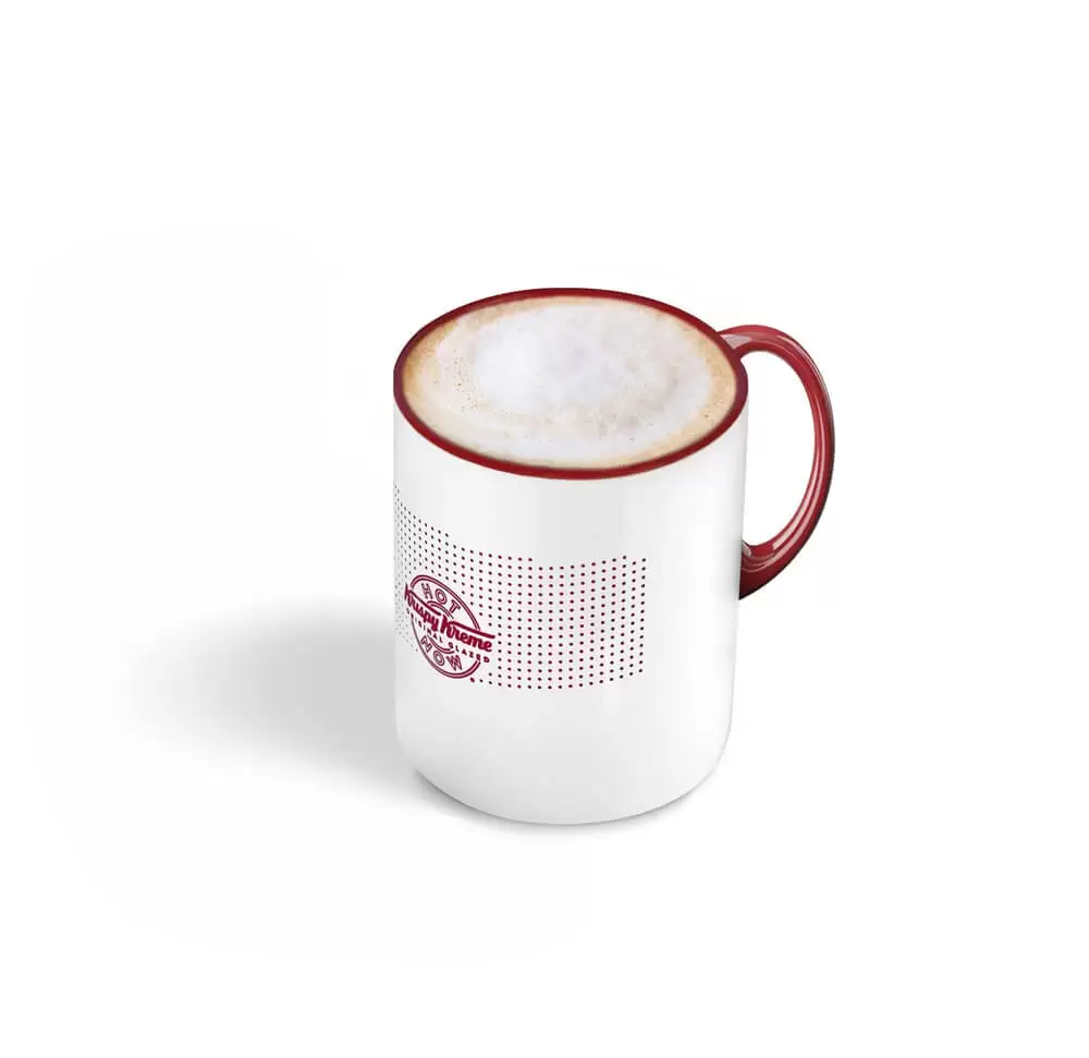 Café à Lausanne : Cappuccino, Krispy Kreme, Un équilibre parfait entre espresso, lait vapeur et mousse de lait.