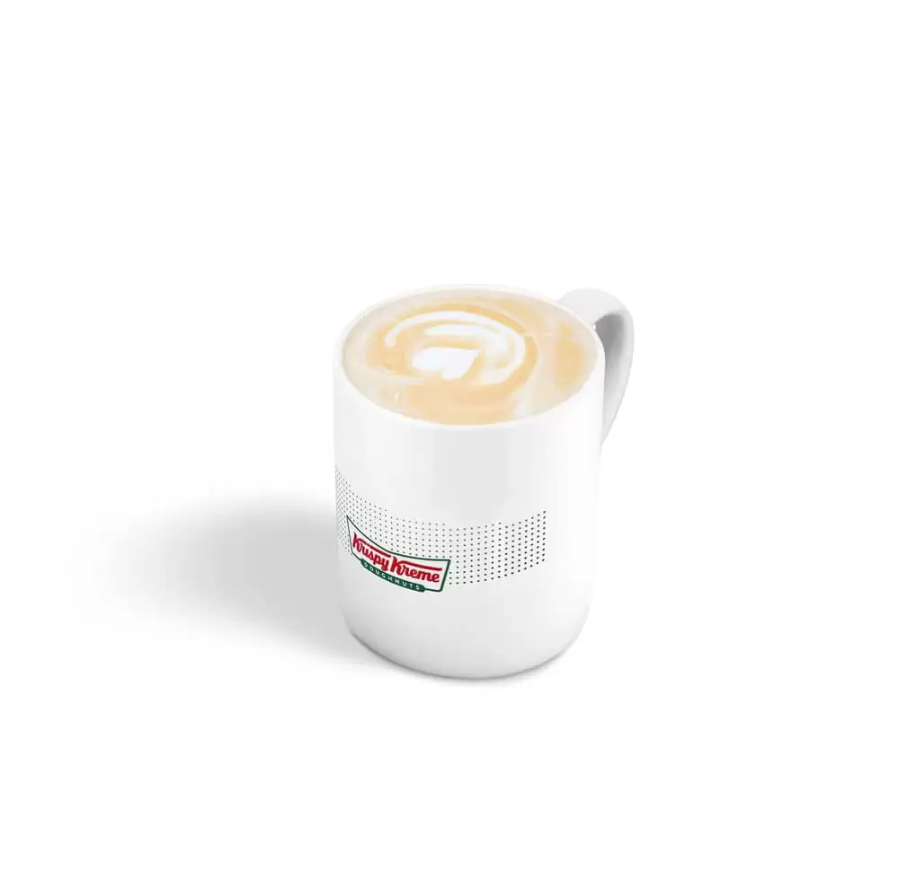 Café à Lausanne : Flat White, Krispy Kreme, Un espresso accompagné d’une fine mousse de lait pour une texture douce et veloutée.
